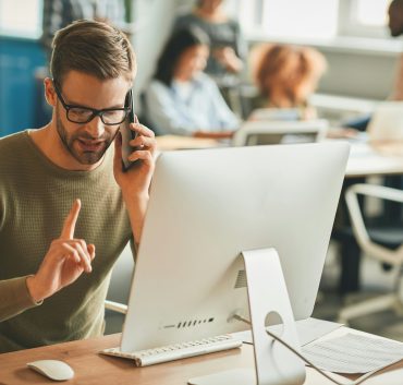 patient-call-center-operator-gesturing-during-a-phone-call.jpg